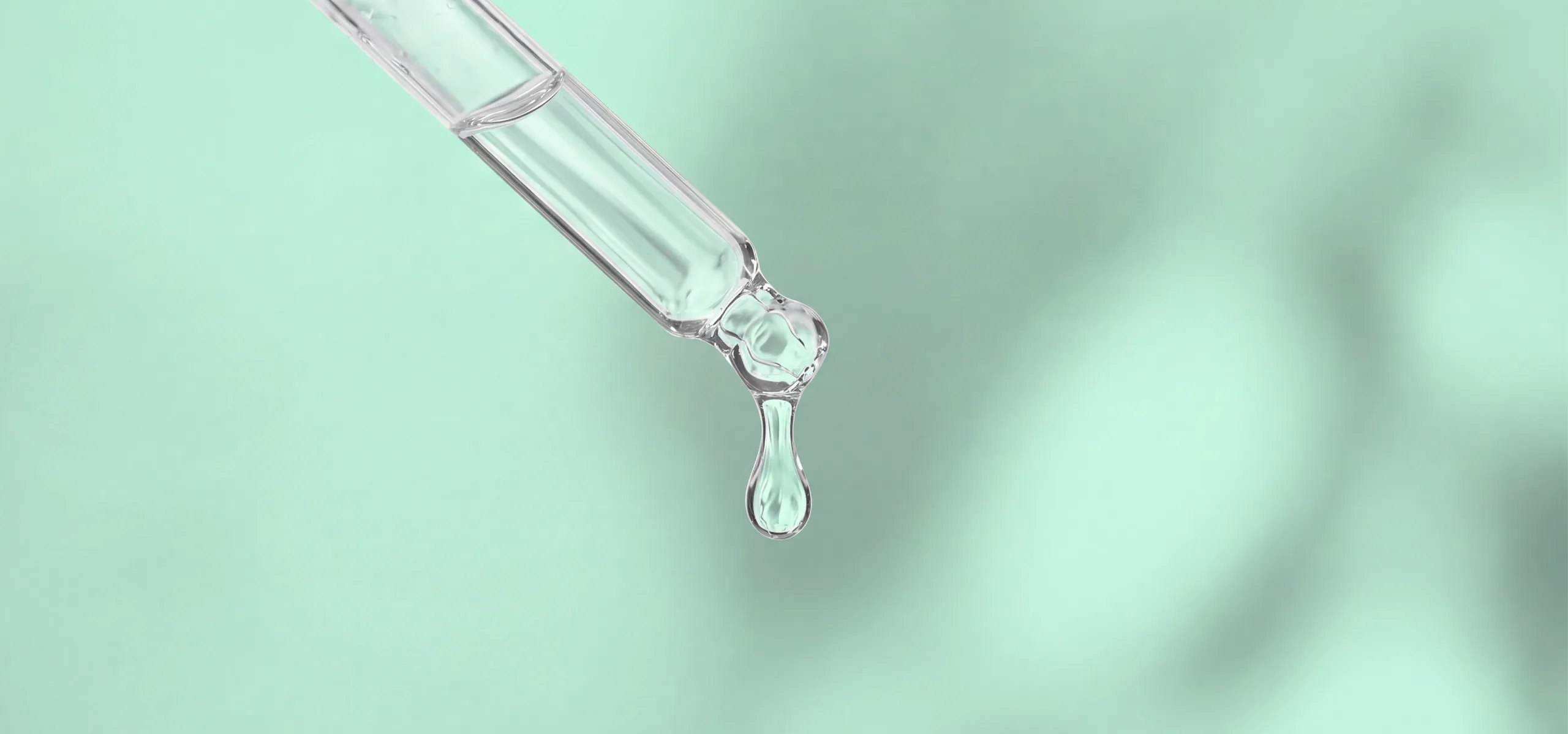 Clinical dropper dispensing clear serum droplet with scientific precision